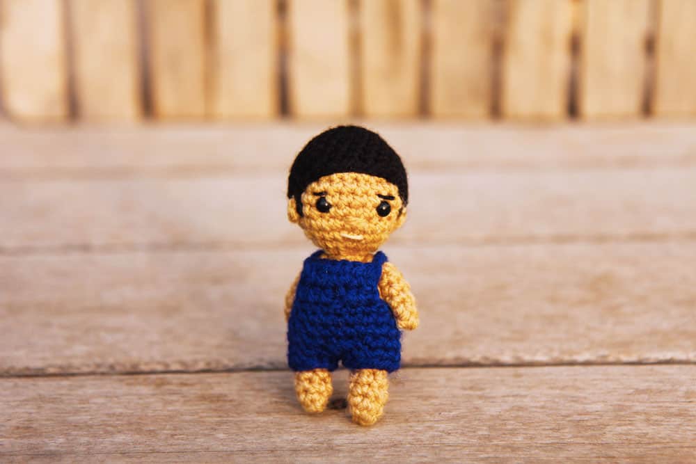 small crochet boy doll with overalls